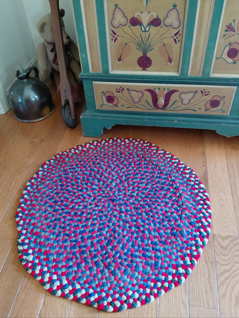 Antique pre 1920s family owned handmade round red & blue braided rag rug - 29"